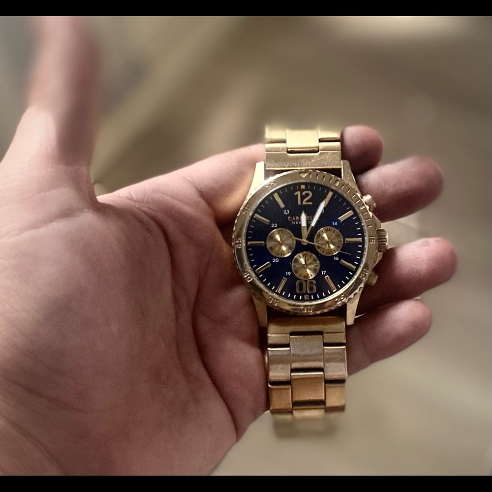 Caravelle gold watch with a blue face